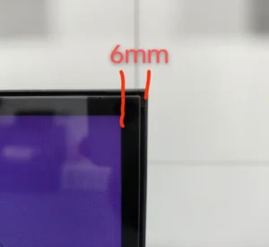 6mm distance between the display region and the frame edge, fairly small enough to be ignored.