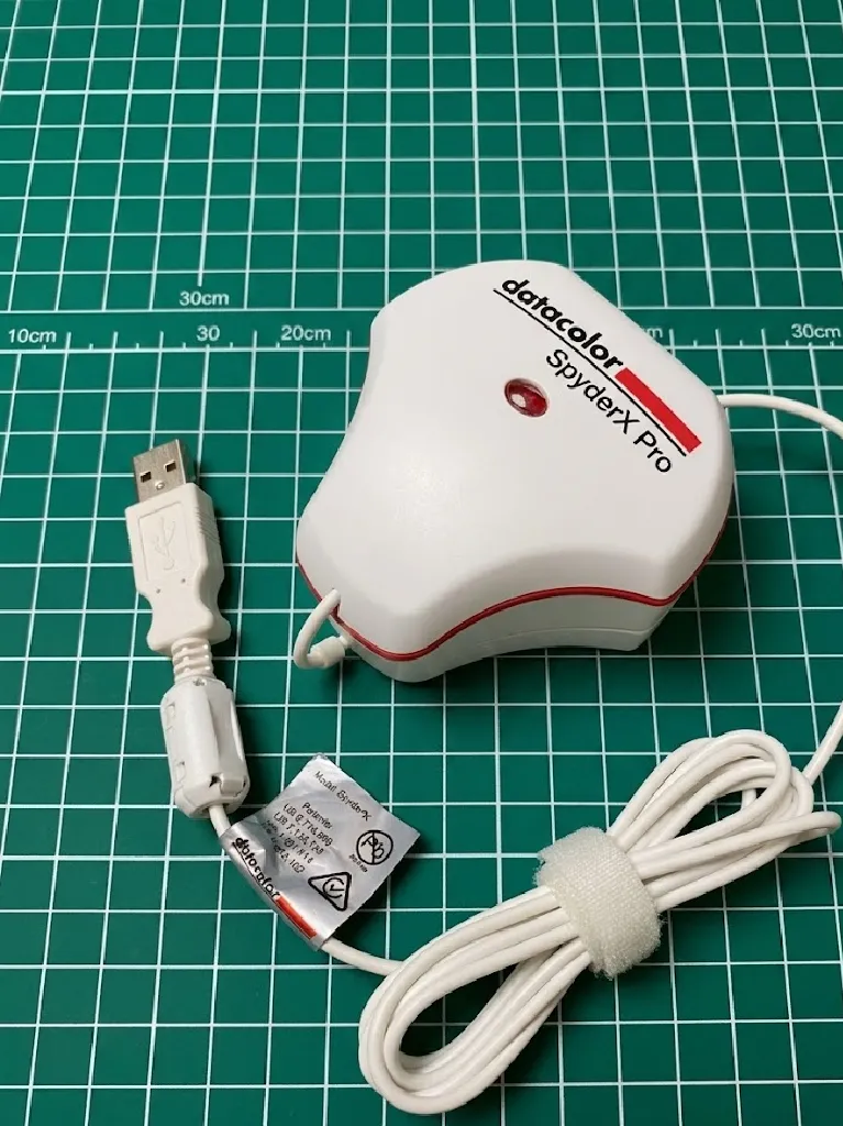 Color calibrator SpyderX. It is used to do color calibration and also detect the brightness, perfect for monitors.